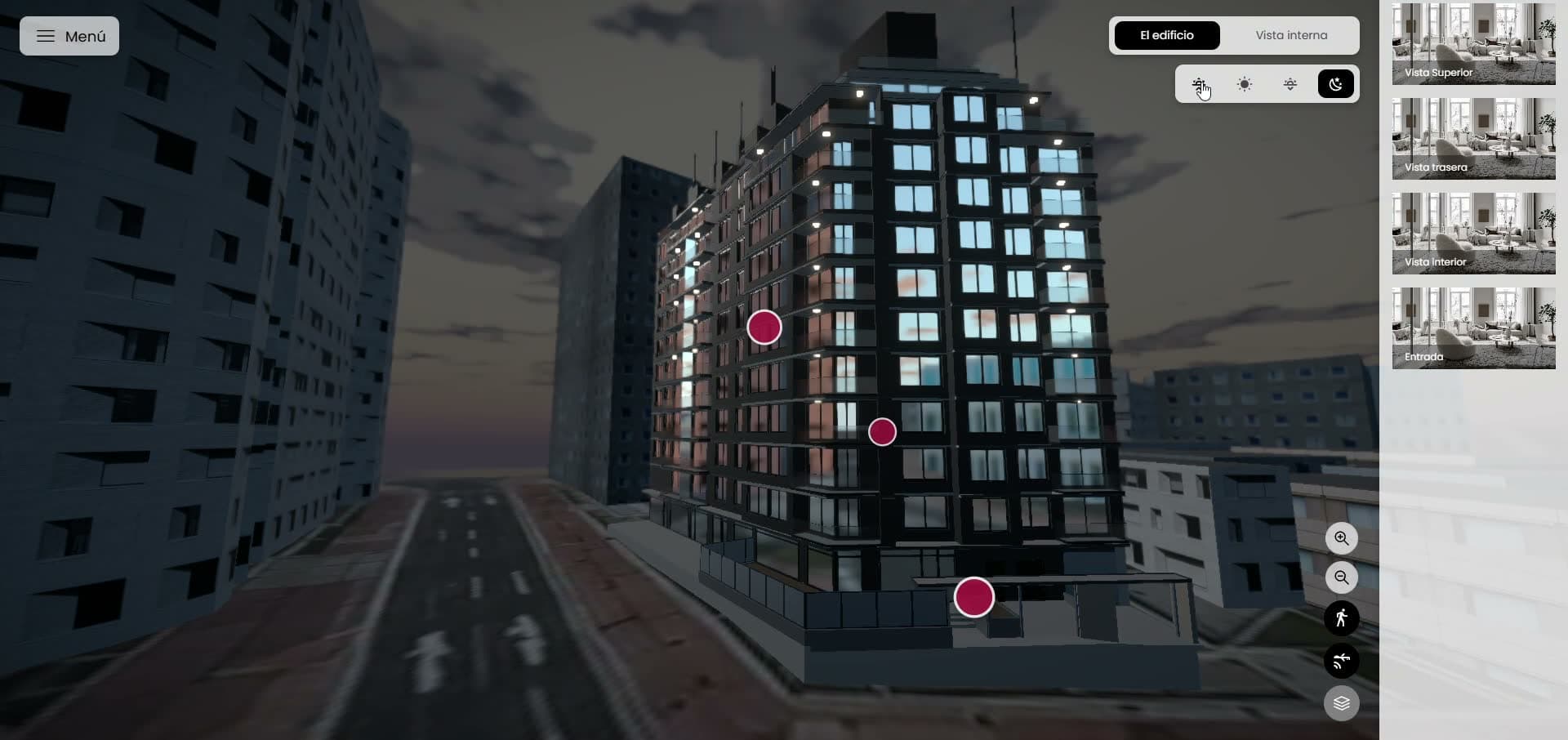 El mismo edificio al anochecer, con las ventanas encendidas