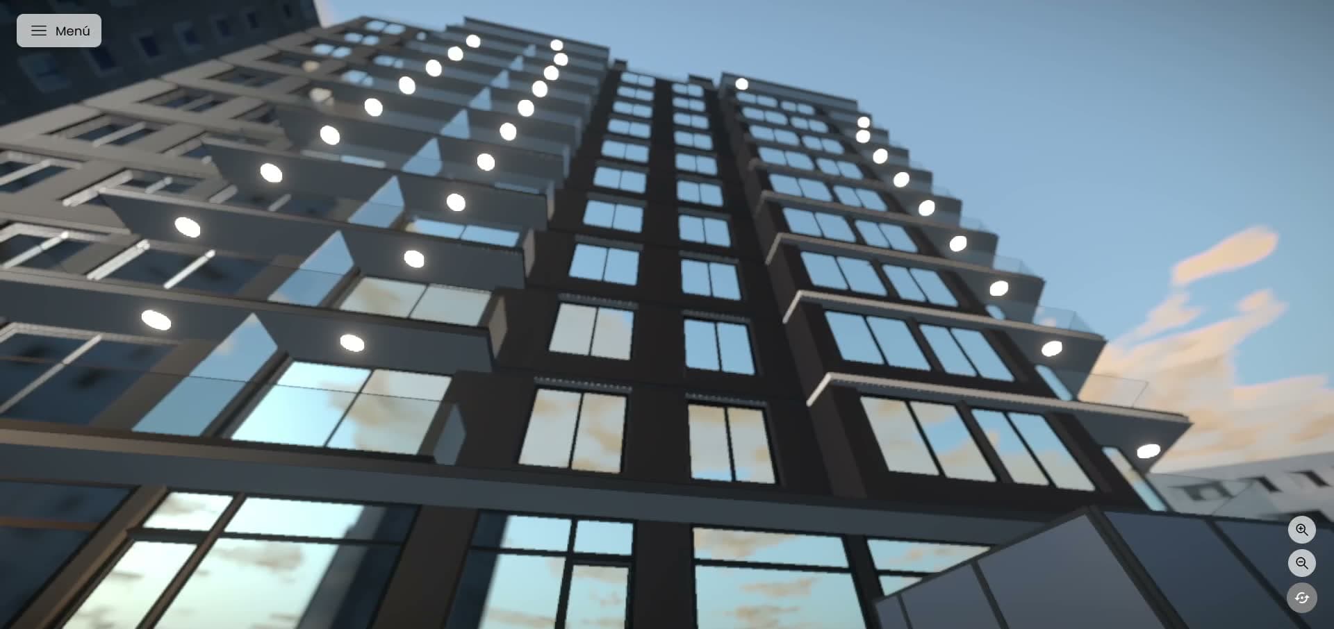 La fachada desde abajo, con el vidrio reflejando el cielo